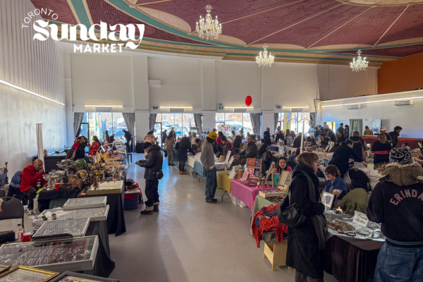 Vendor items for sale including hand bags, fresh food, Jewellry, Art, Crochet