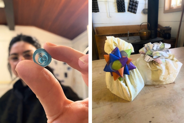 Artist holding a blue quilled circle and two cloth wrapped gifts with bows.