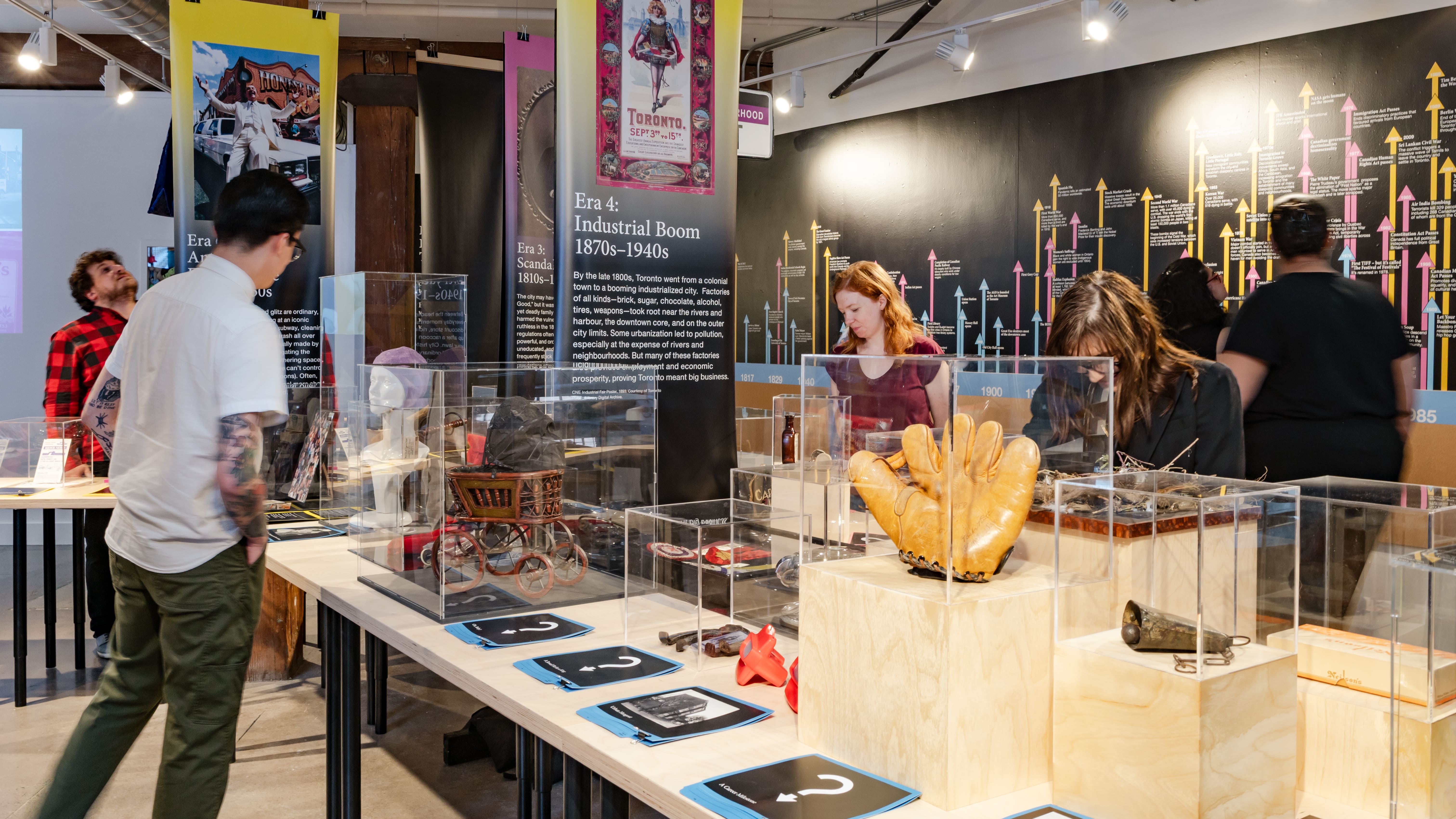 A couple of people look through an exhibit