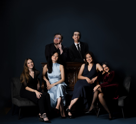A group of young musicians pose together.