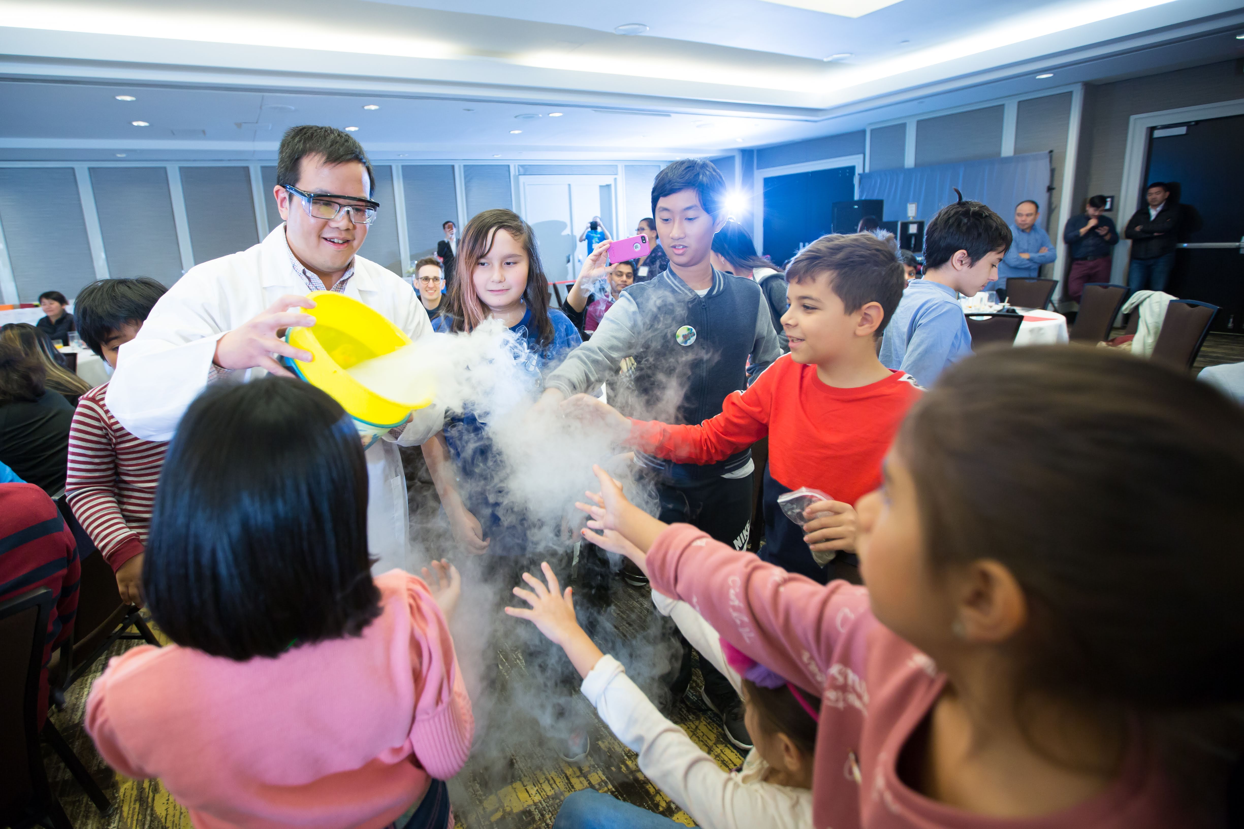 Scientist giving a demonstration of a science experiment for children