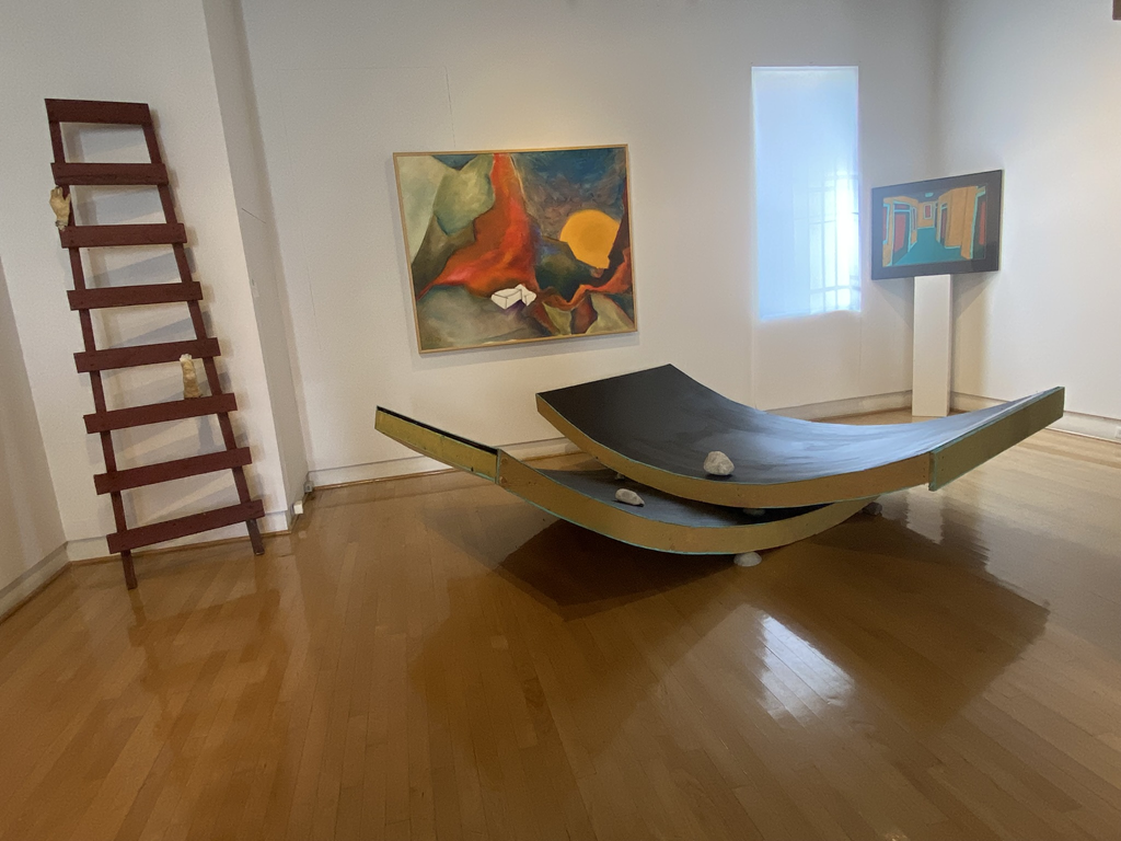 Sculptures and paintings in the west gallery space.