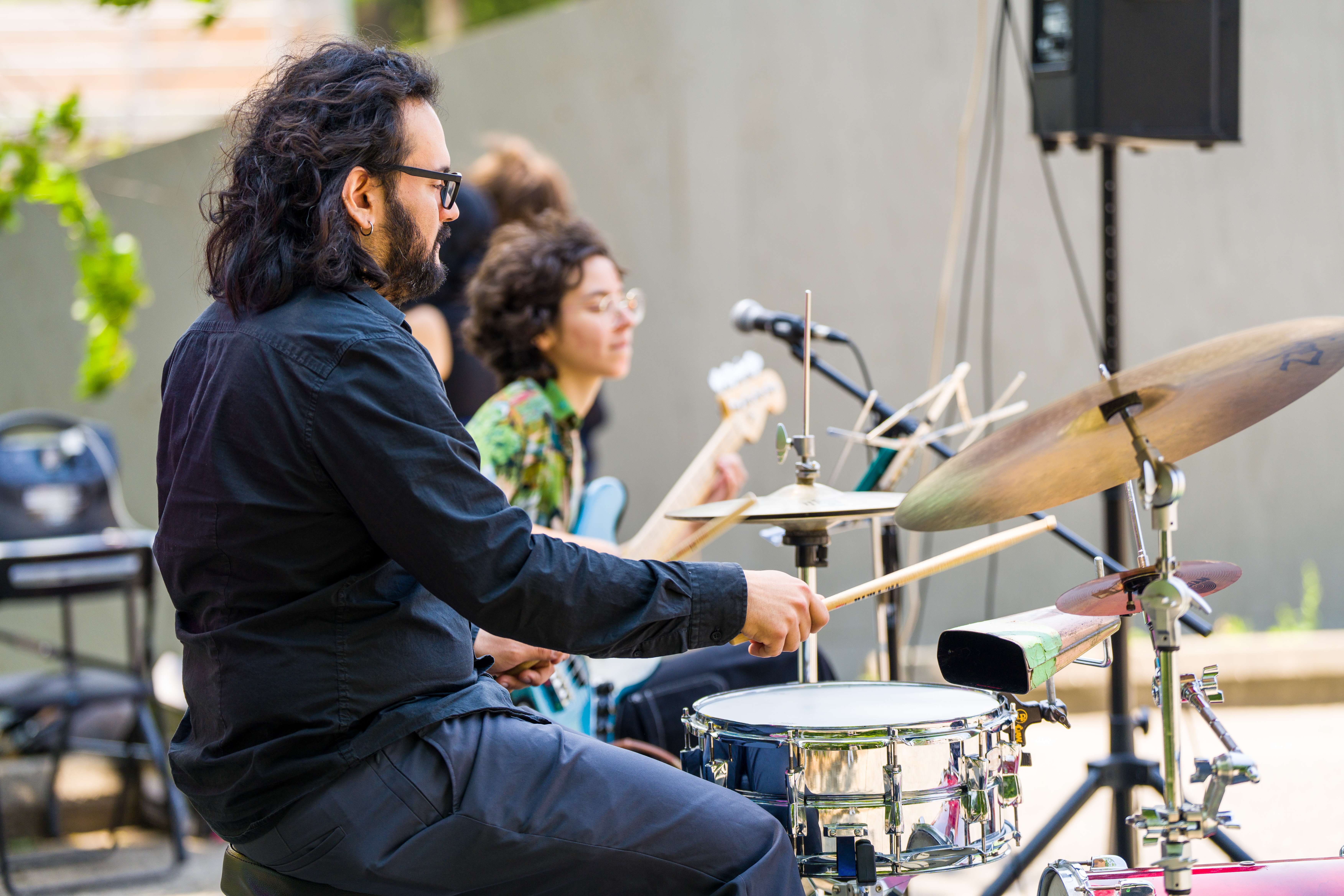 Musical instruments and performers bringing live music to life at Music Creators Day, celebrating creativity and music.