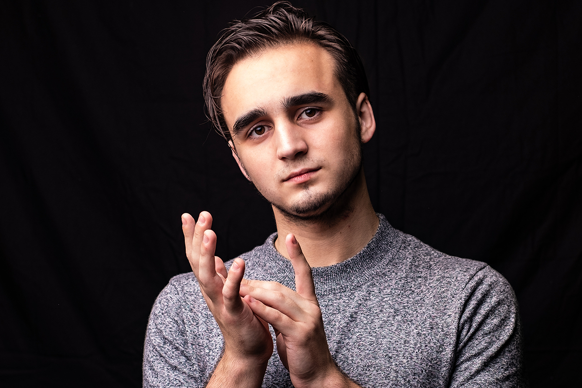 Young pianist in a grey t-shirt