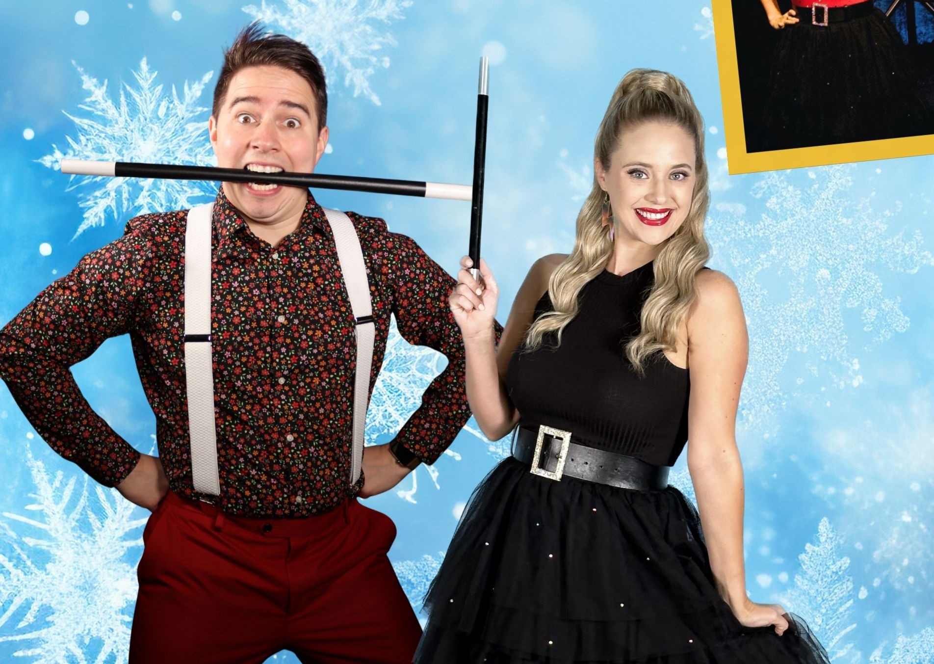two people in magician clothing holding magic wand stick with a light blue christmas background