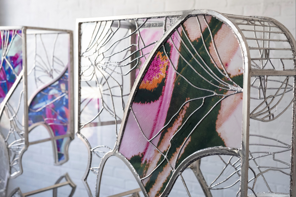 Zoomed in view of Ry Van Der Hout's sculpture made of stained glass and metal