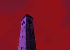 A red cloudy sky over purple rolling hills and a crumbling brick tower.