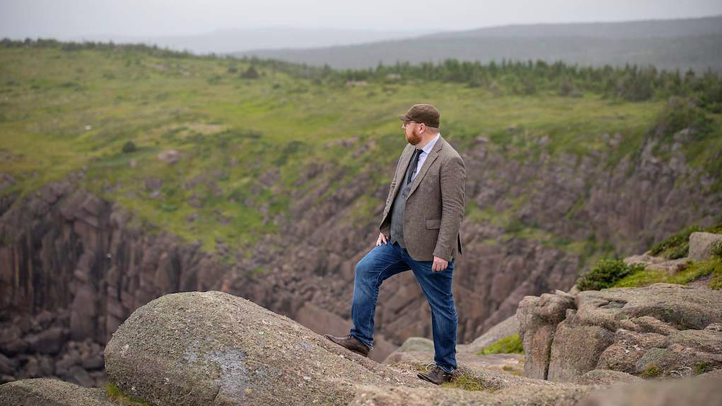 Man standing on rock outcropping