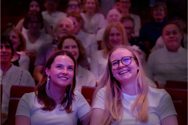 Two festival-goers watching a EUFF film