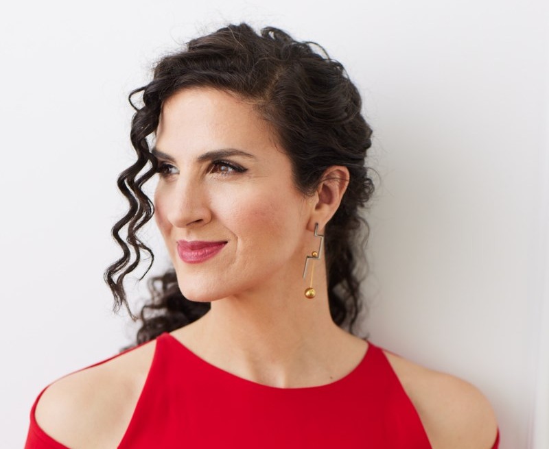 Laila Biali wears a red dress.