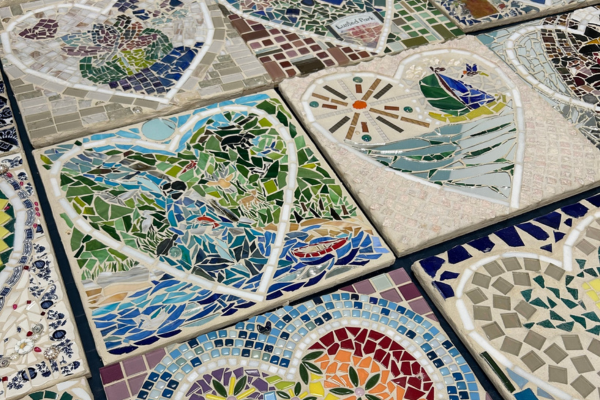 Nine panel mosaic artwork, each panel has a heart with multicoloured designs.