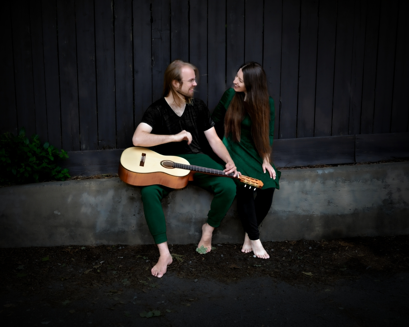 Glyph Greenleaf with his distinctive lap-style classical guitar, alongside Victoria Dobbs of duo Imaginary Expedition.
