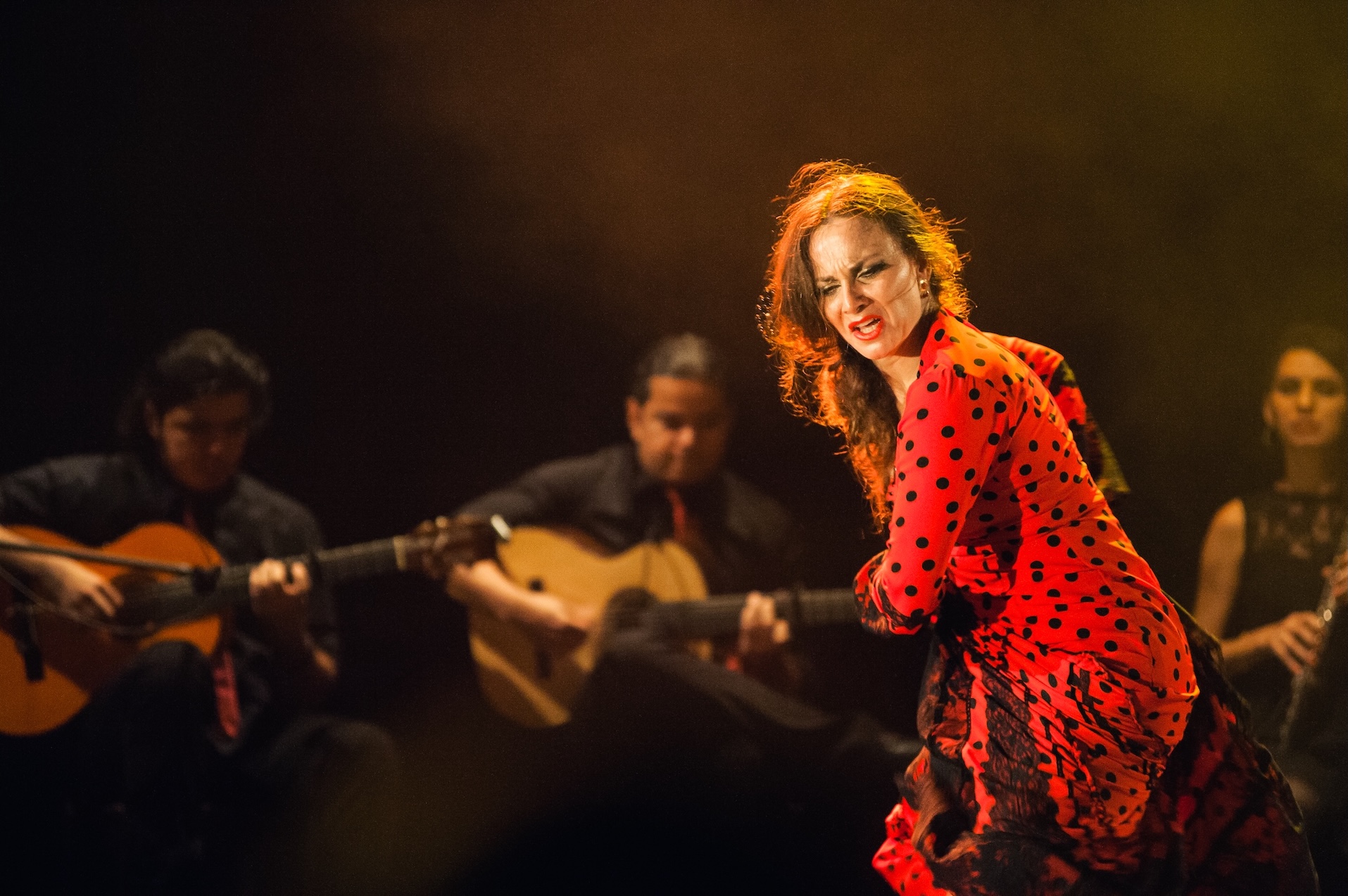 Carmen Talegona, flamenco dancer in a red dress with black polka dots.