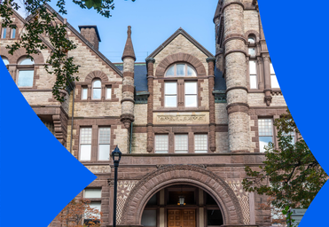 A historic sandstone romanesque building.