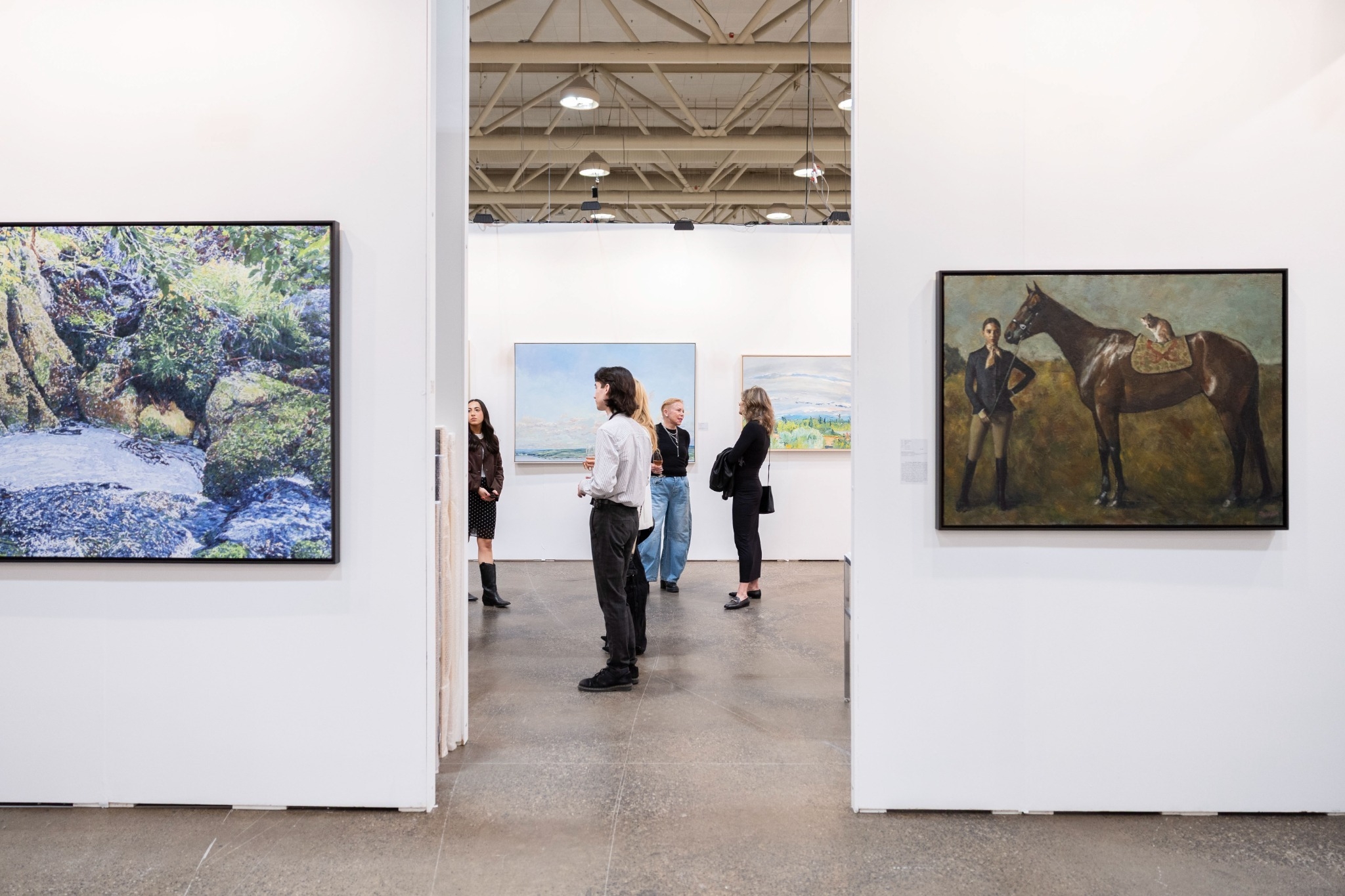 Gallery floor with paintings on display